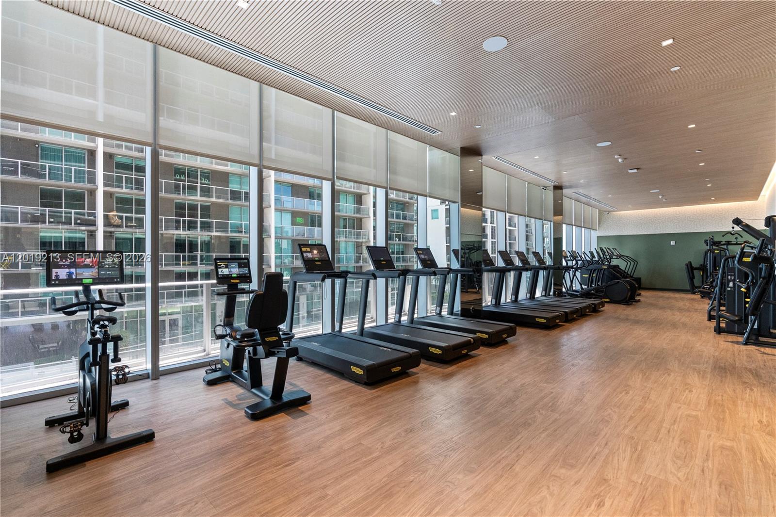 77 Southeast 5th, Unit 3702 Miami, FL 33131 - Photo 44 of 63 a view of a room with gym equipment