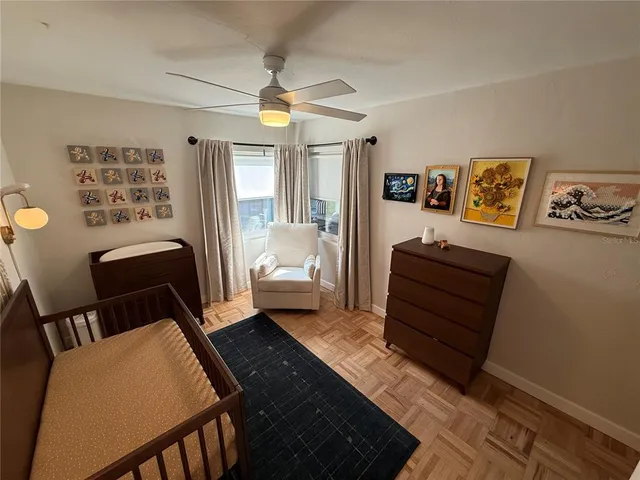 a bedroom with furniture and a rug