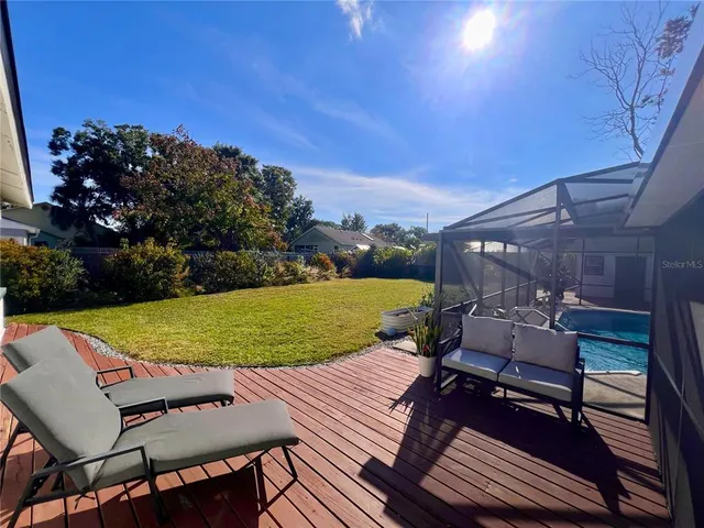 a view of a swimming pool with a patio