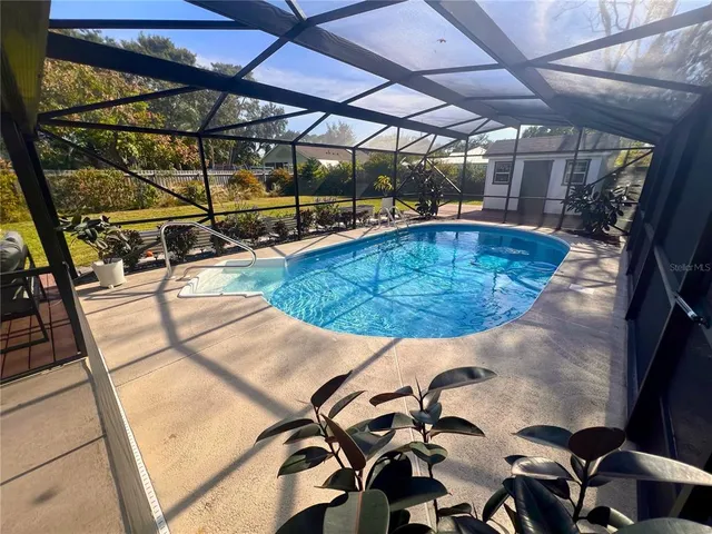 a view of a swimming pool with a patio