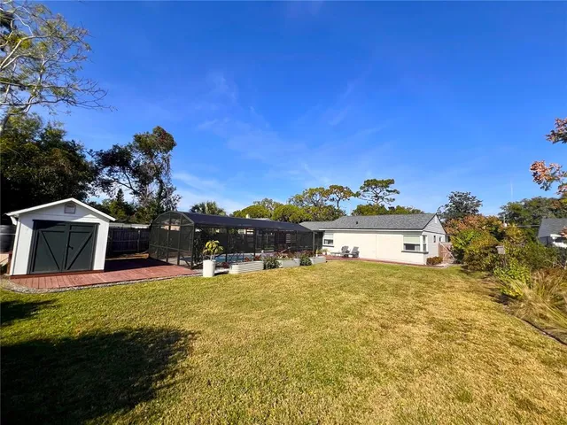 a view of a house with a yard