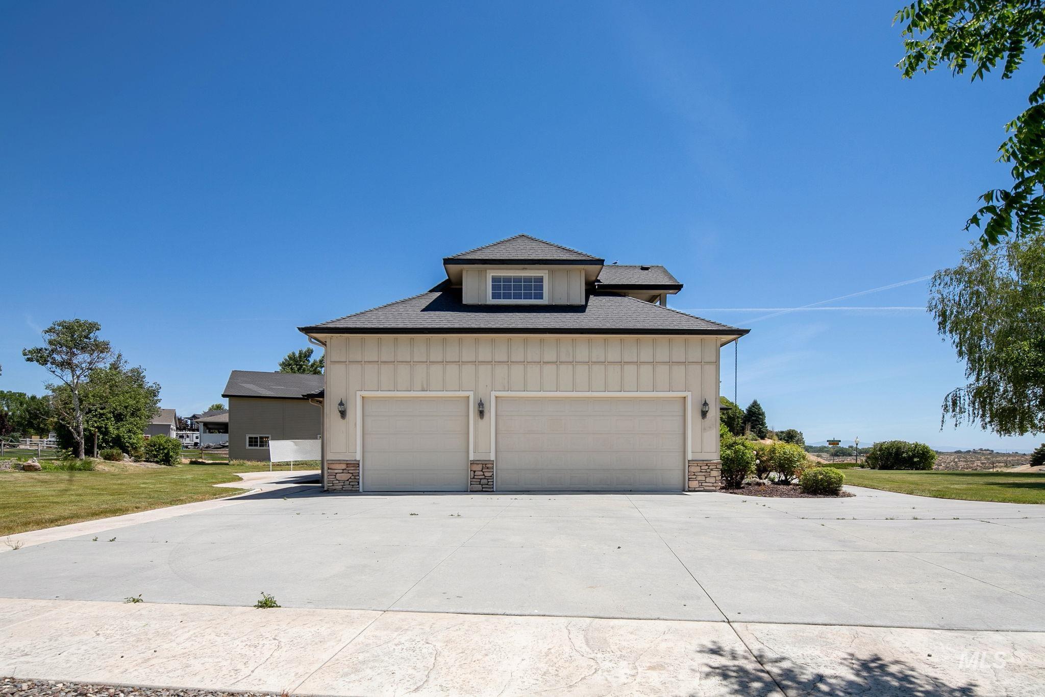 6850 Purple Sage Road Star, ID 83669 - Photo 8 of 50 Entryway featuring a natural wood-finish door with sidelights