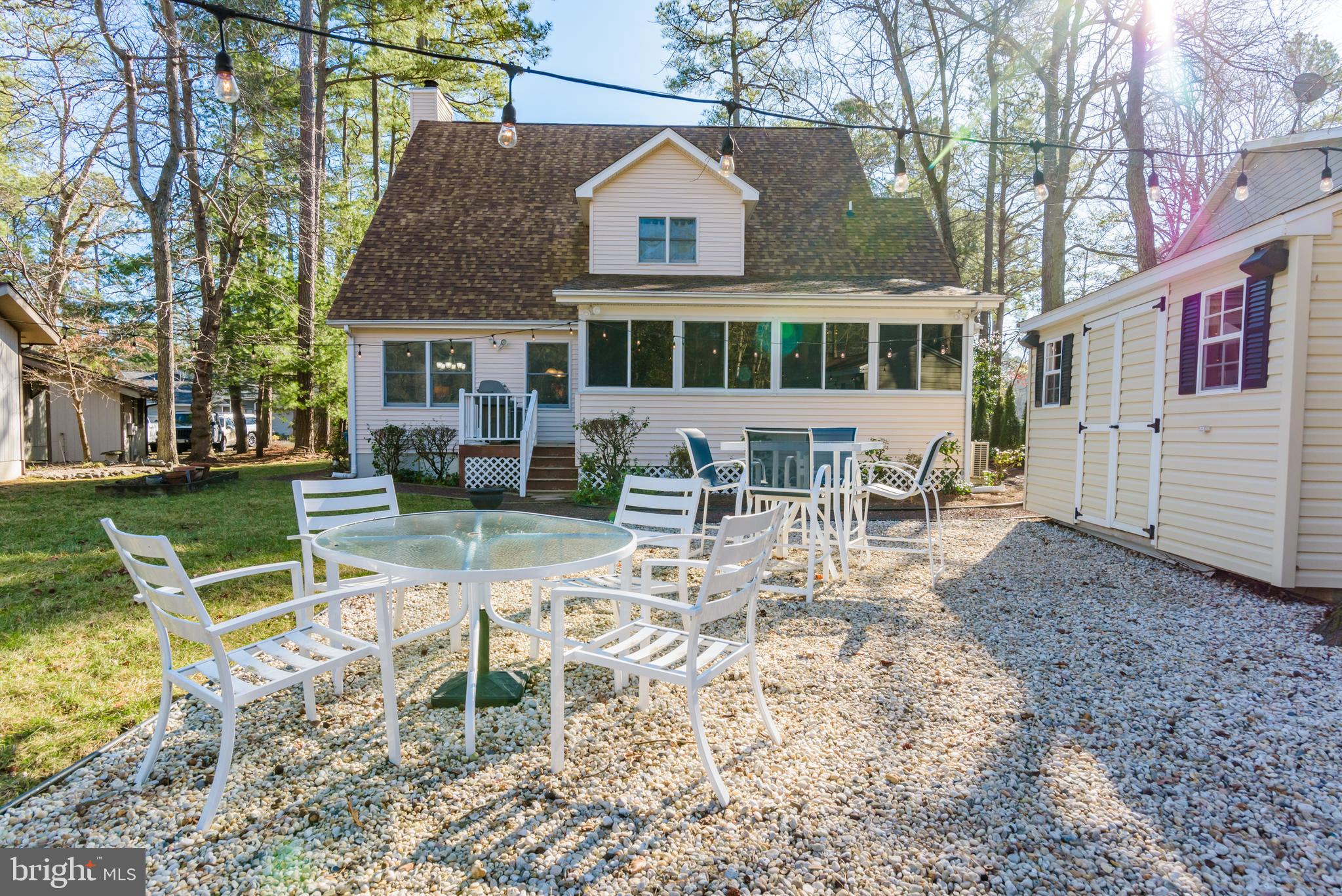 11 Drawbridge Road Berlin, MD 21811 - Photo 51 of 78 a view of house with a yard chairs and table