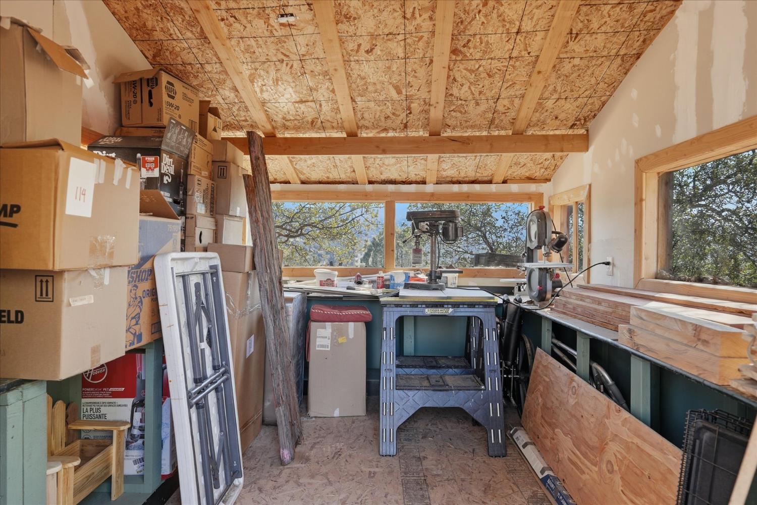 32583 River Knolls Road Coarsegold, CA 93614 - Photo 54 of 63 a view of a kitchen with a sink and dishwasher a refrigerator with wooden floor
