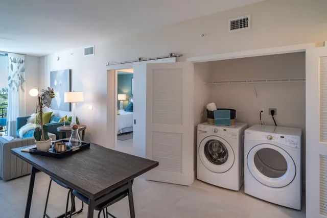 a view of kitchen and refrigerator