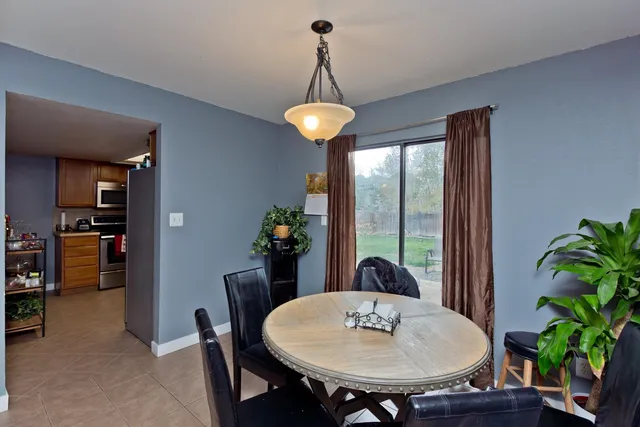 a dining room with furniture and window