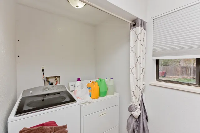 a bathroom with a sink and a shower curtain