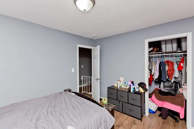 a bed room with a bed and a window