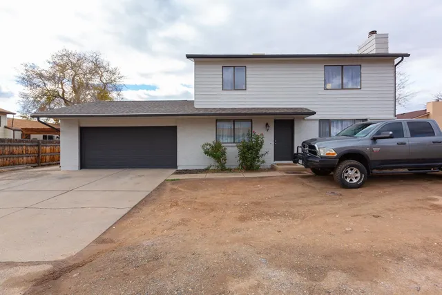 a view of a car parked in front of house