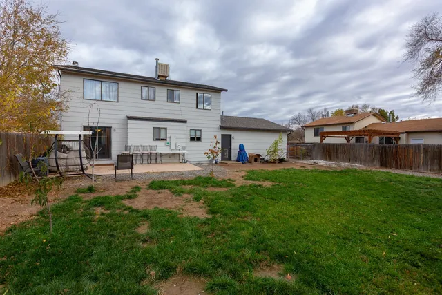 a view of a house with a back yard