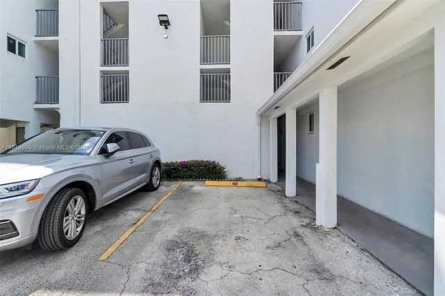 a view of a car in front of a house