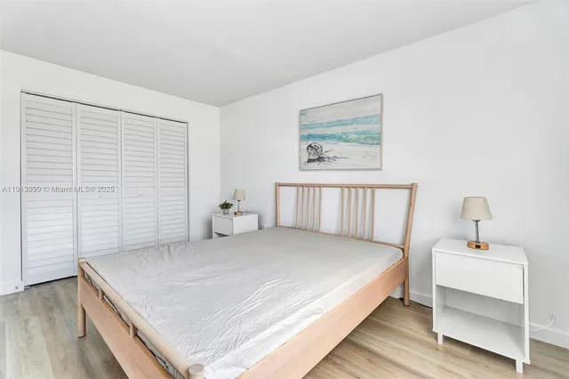 a bedroom with a bed and a table