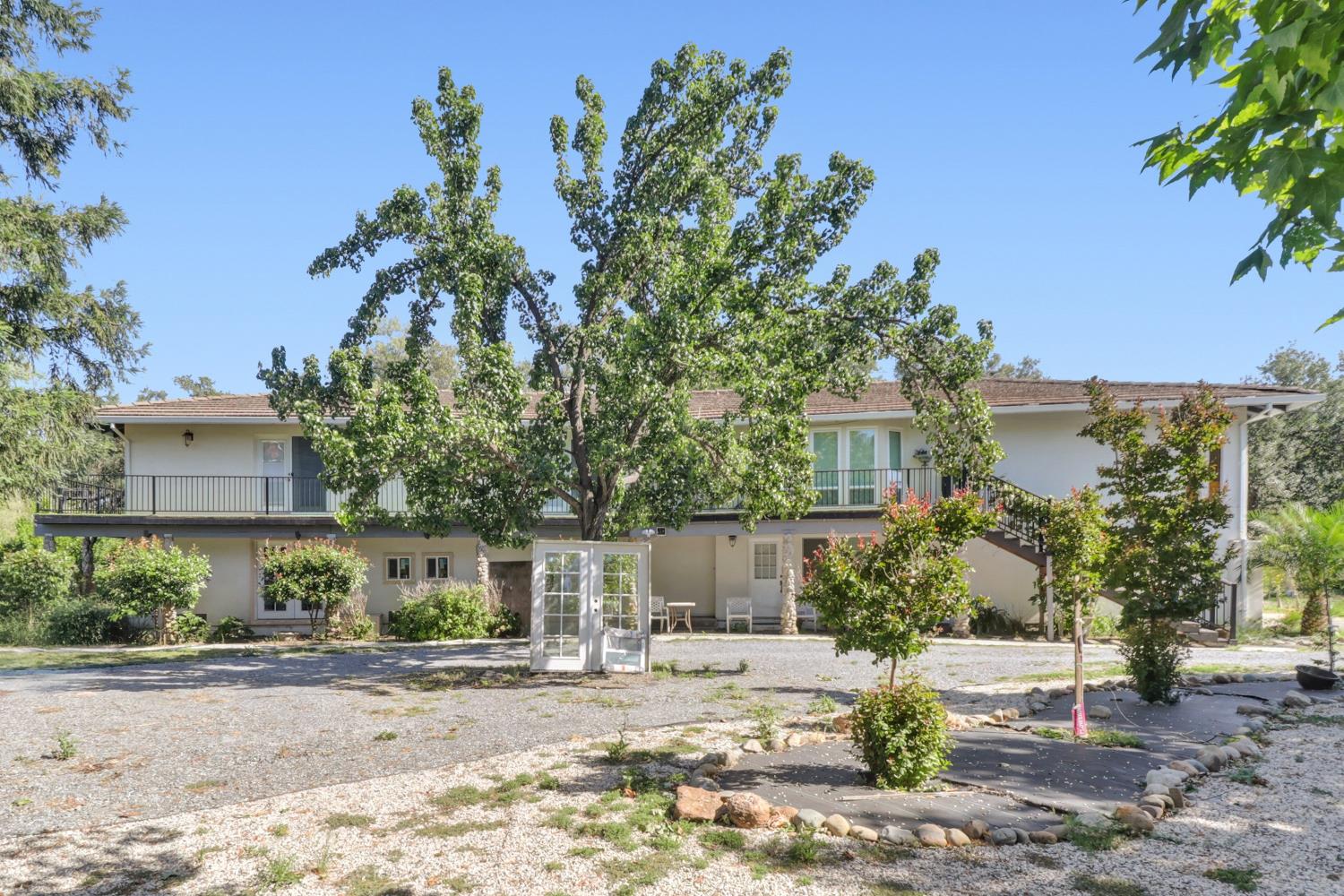 4330 Cavitt Stallman Road Granite Bay, CA 95746 - Photo 2 of 85 a front view of a house with a yard and a garage