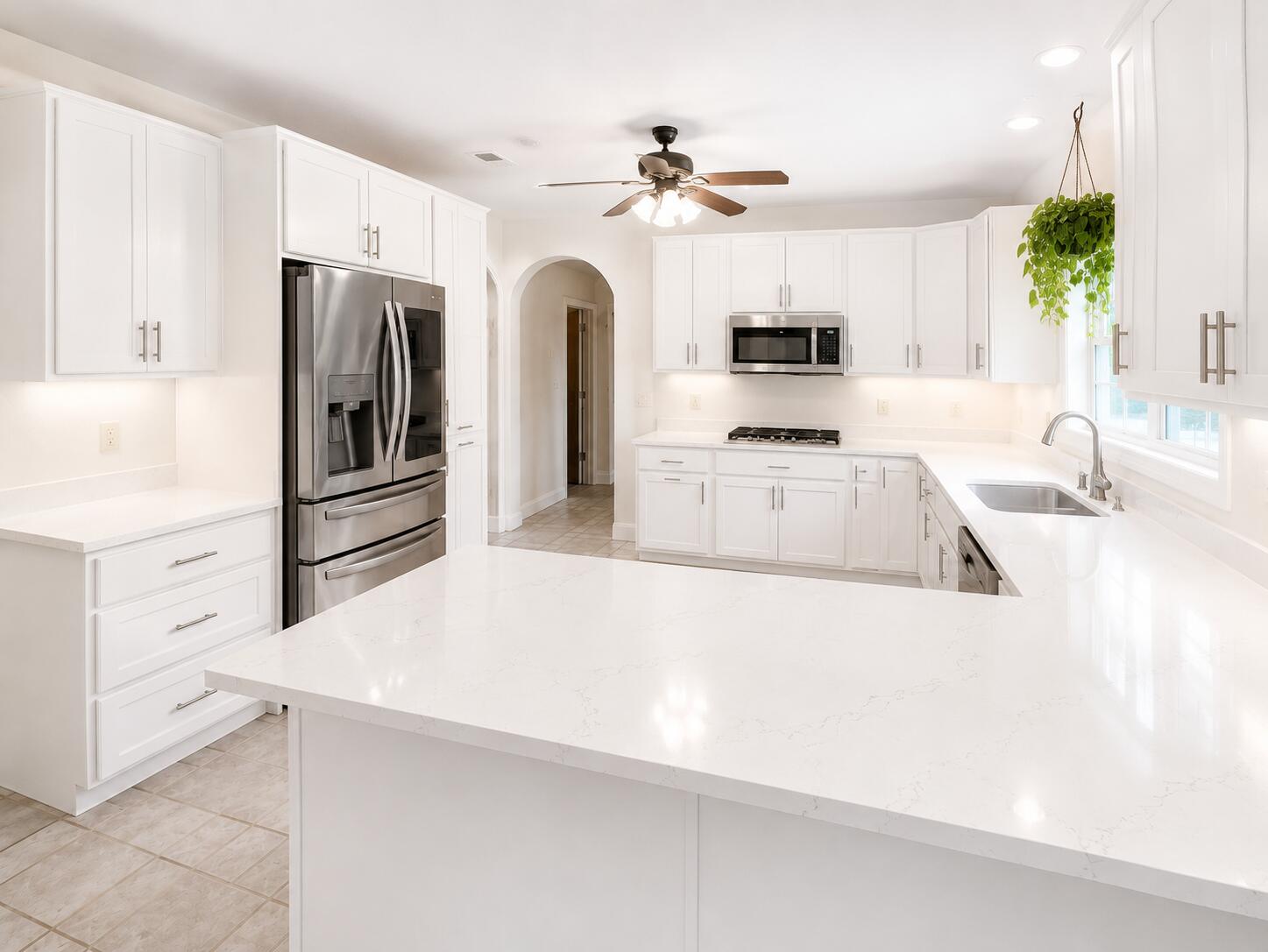 147 Dover Lane Freeport, FL 32439 - Photo 2 of 27 a kitchen with stainless steel appliances a refrigerator sink and stove