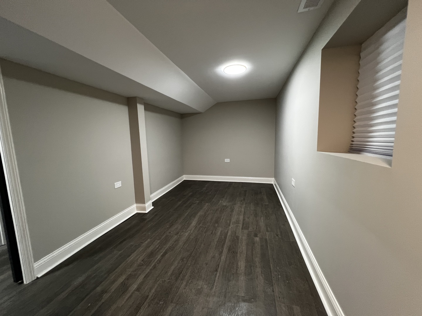 4956 West Erie Street, Unit 1 Chicago, IL 60644 - Photo 19 of 25 an empty room with wooden floor