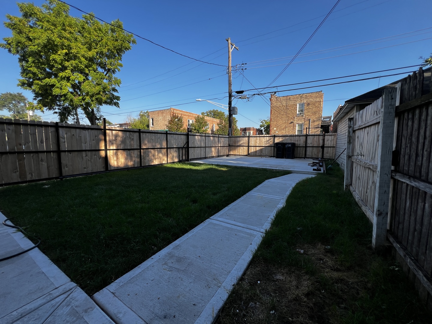 4956 West Erie Street, Unit 1 Chicago, IL 60644 - Photo 21 of 25 a view of a house with a yard