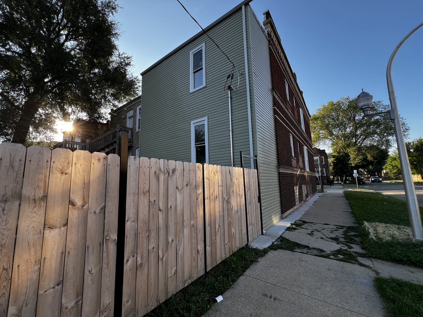 4956 West Erie Street, Unit 1 Chicago, IL 60644 - Photo 24 of 25 a side view of a house with a yard