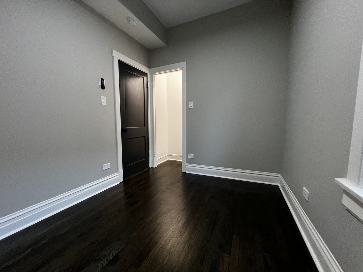 4956 West Erie Street, Unit 1 Chicago, IL 60644 - Photo 8 of 25 wooden floor in an empty room