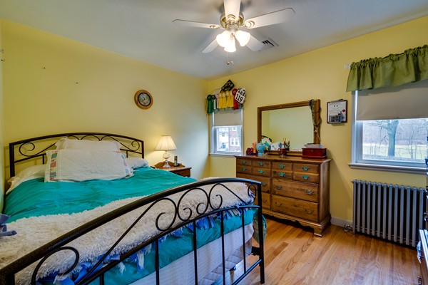 28 Myopia Road Boston, MA 02136 - Photo 11 of 16 a view of a bedroom with furniture window and wooden floor