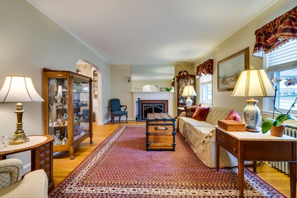28 Myopia Road Boston, MA 02136 - Photo 3 of 16 a living room with furniture a lamp and a fireplace
