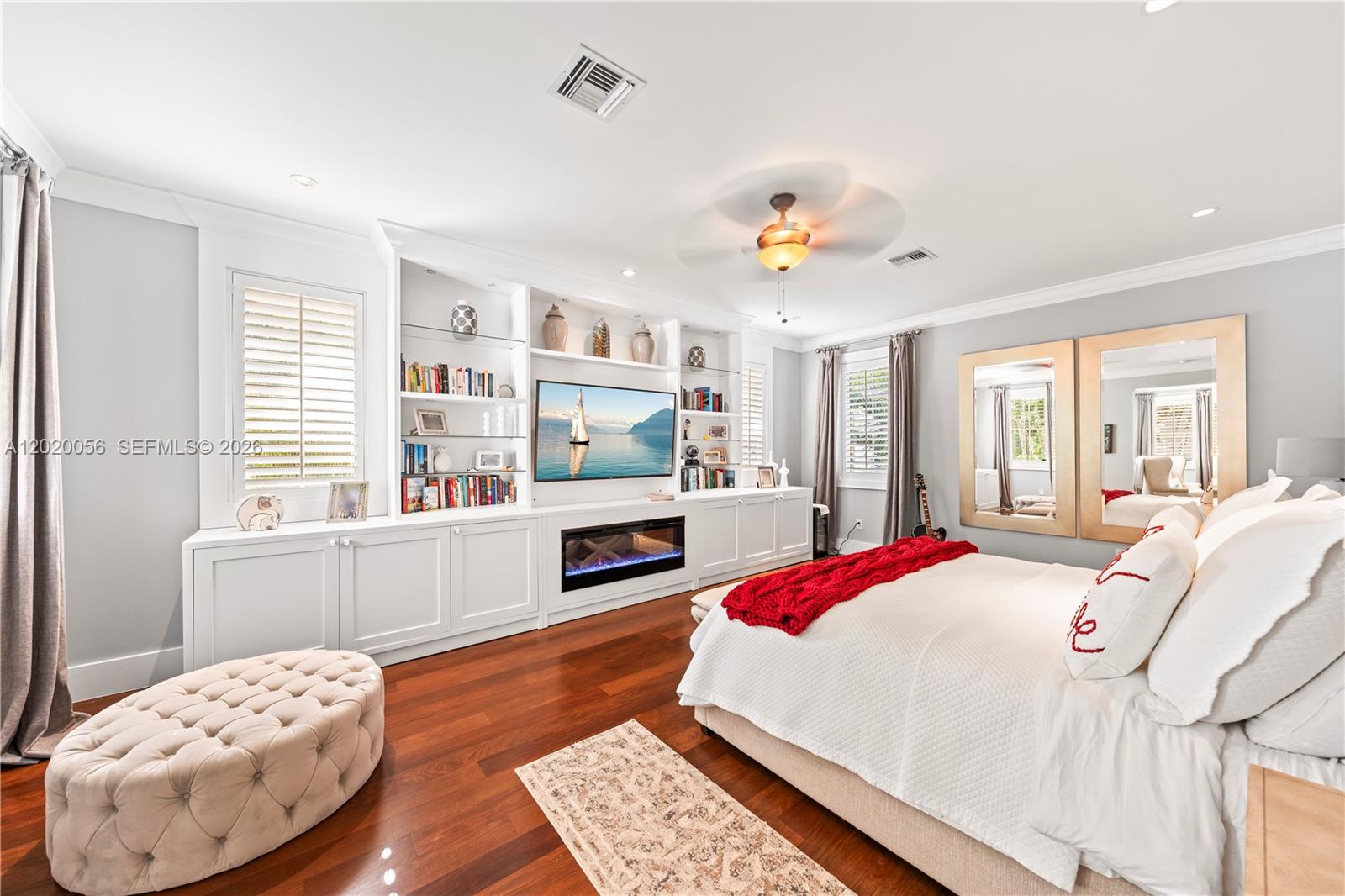 4196 Douglas Road Miami, FL 33133 - Photo 49 of 96 a bedroom with a bed and a large window