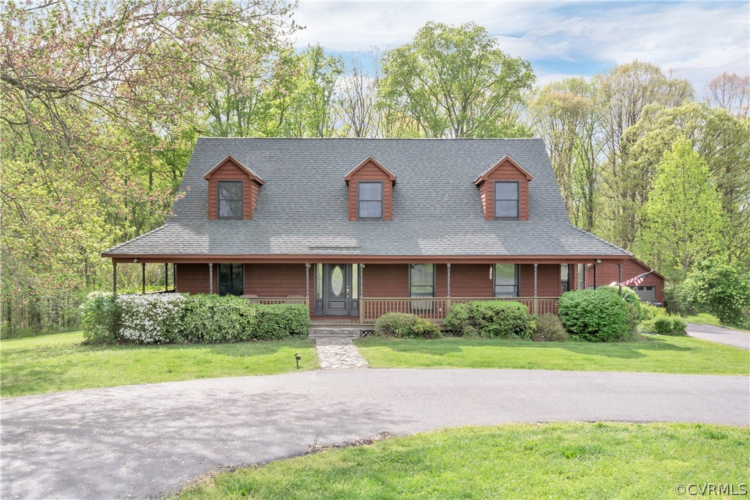 2661 Bibb Store Road Louisa, VA 23093 - Photo 1 of 35 a front view of a house with garden