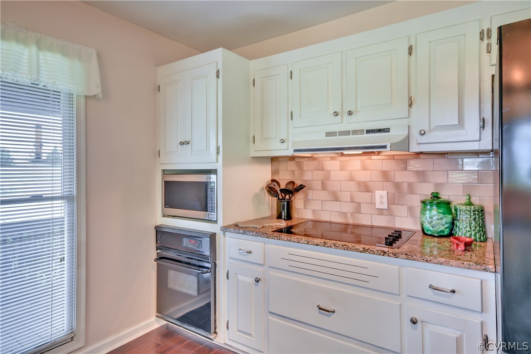 2661 Bibb Store Road Louisa, VA 23093 - Photo 13 of 35 a kitchen with white cabinets and appliances