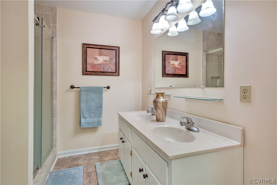 2661 Bibb Store Road Louisa, VA 23093 - Photo 17 of 35 a bathroom with a sink vanity and mirror