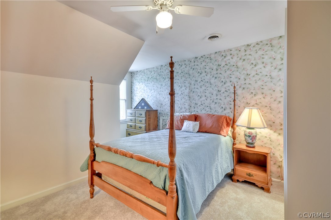2661 Bibb Store Road Louisa, VA 23093 - Photo 25 of 35 a bedroom with a bed and lamp