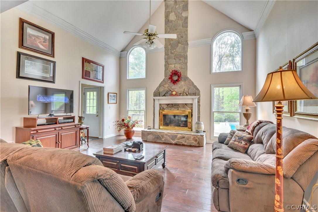 2661 Bibb Store Road Louisa, VA 23093 - Photo 7 of 35 a living room with furniture a fireplace and a flat screen tv