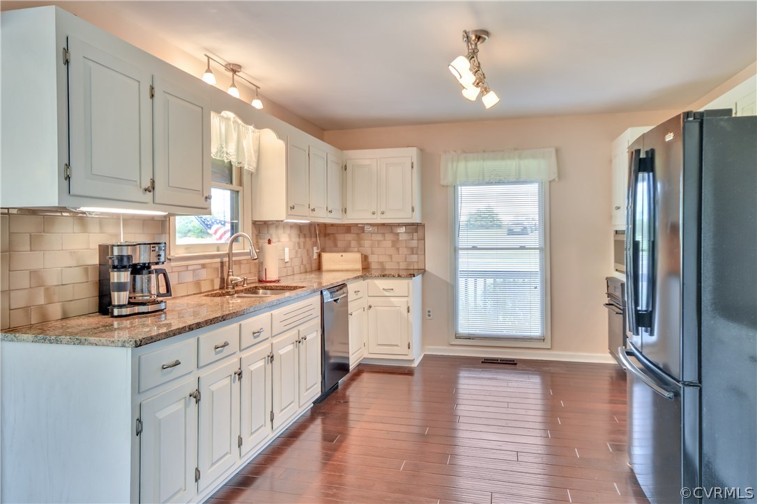 2661 Bibb Store Road Louisa, VA 23093 - Photo 10 of 35 a kitchen with a refrigerator sink and cabinets