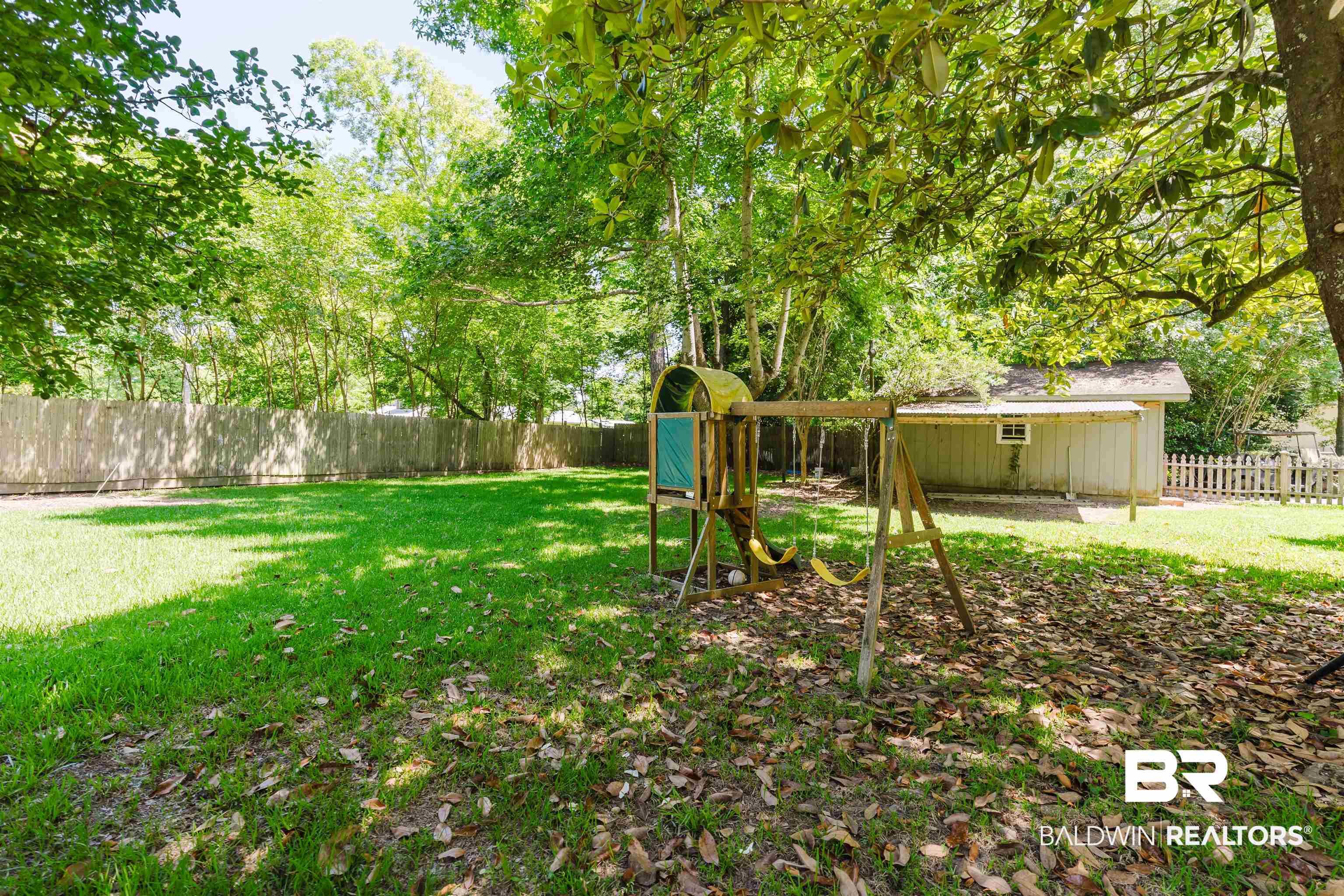 20460 Bishop Road Fairhope, AL 36532 - Photo 3 of 41 View of yard with a playground and an outdoor structure