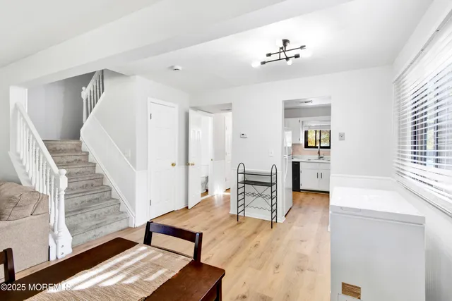 a view of a livingroom with furniture and a ceiling fan