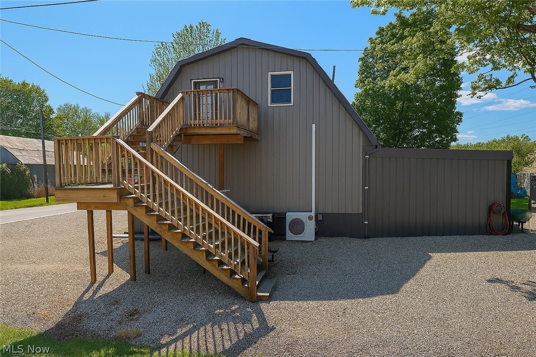 3995 Clay Pike Road Cambridge, OH 43725 - Photo 2 of 10 View of side facade featuring stairs and a deck