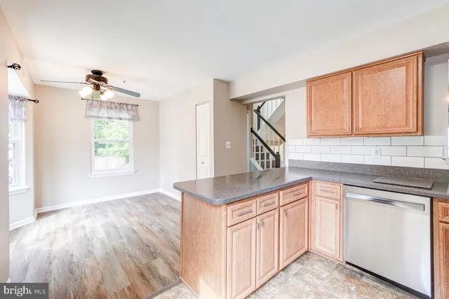 a kitchen with a sink cabinets and window