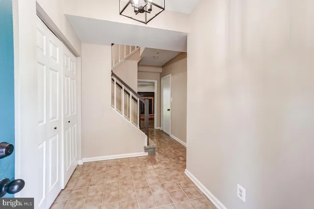 a view of a hallway view with staircase