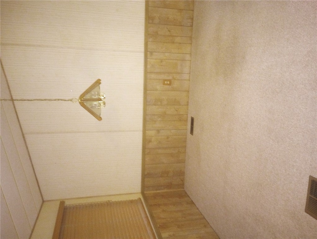 1682 Toro Road Bullhead City, AZ 86442 - Photo 11 of 30 Unfurnished room with carpet and wood walls