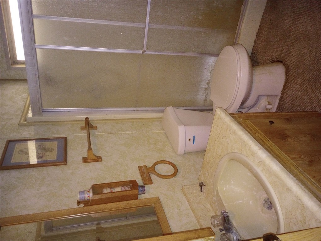 1682 Toro Road Bullhead City, AZ 86442 - Photo 13 of 30 Full bathroom featuring vanity and a stall shower