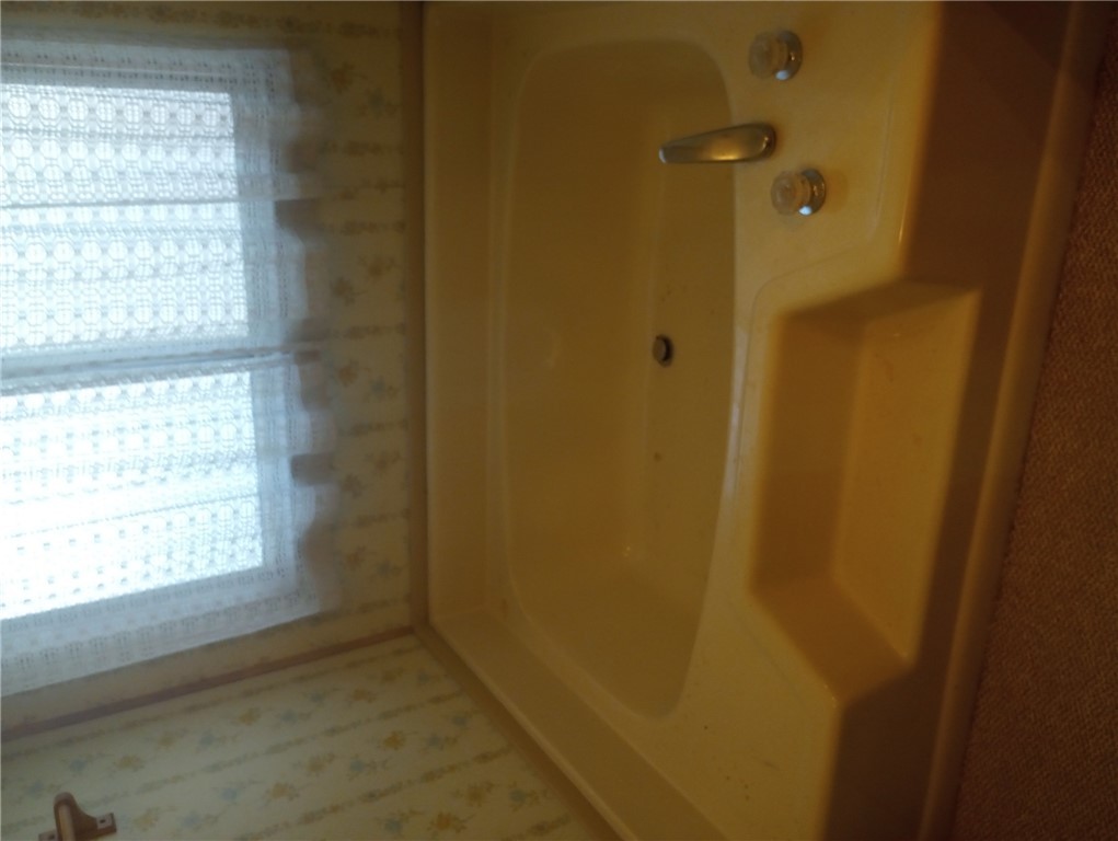 1682 Toro Road Bullhead City, AZ 86442 - Photo 15 of 30 Bathroom featuring a bath and wallpapered walls