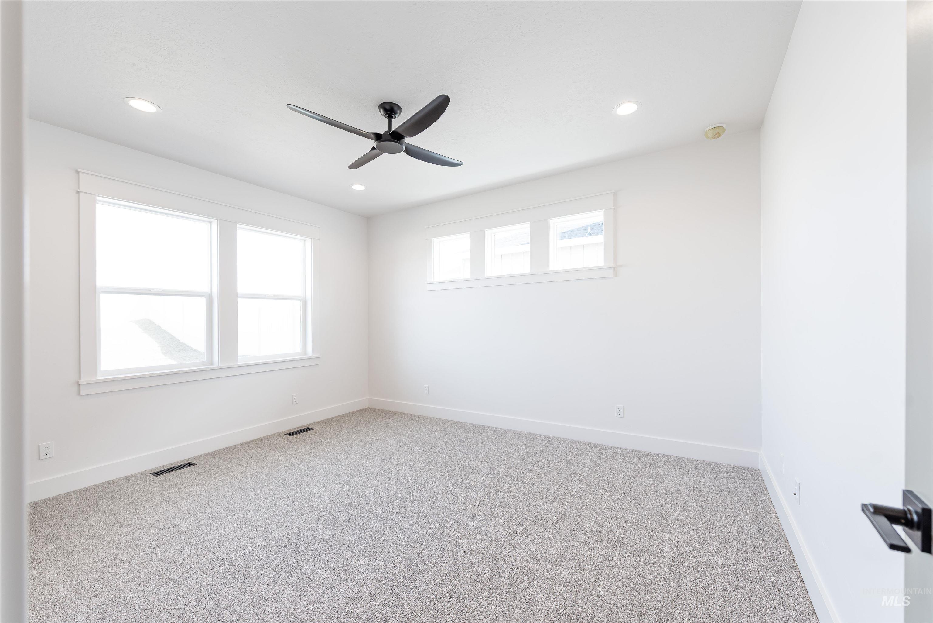 410 South Diesel Way Boise, ID 83716 - Photo 14 of 49 Carpeted spare room with a ceiling fan and recessed lighting