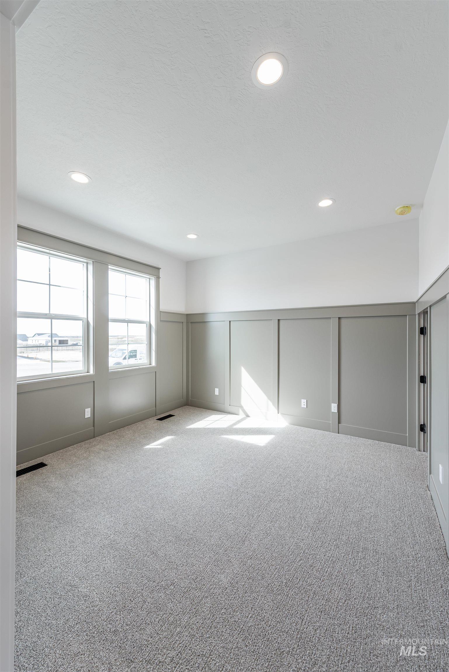 410 South Diesel Way Boise, ID 83716 - Photo 18 of 49 Basement with a decorative wall, carpet flooring, wainscoting, and recessed lighting
