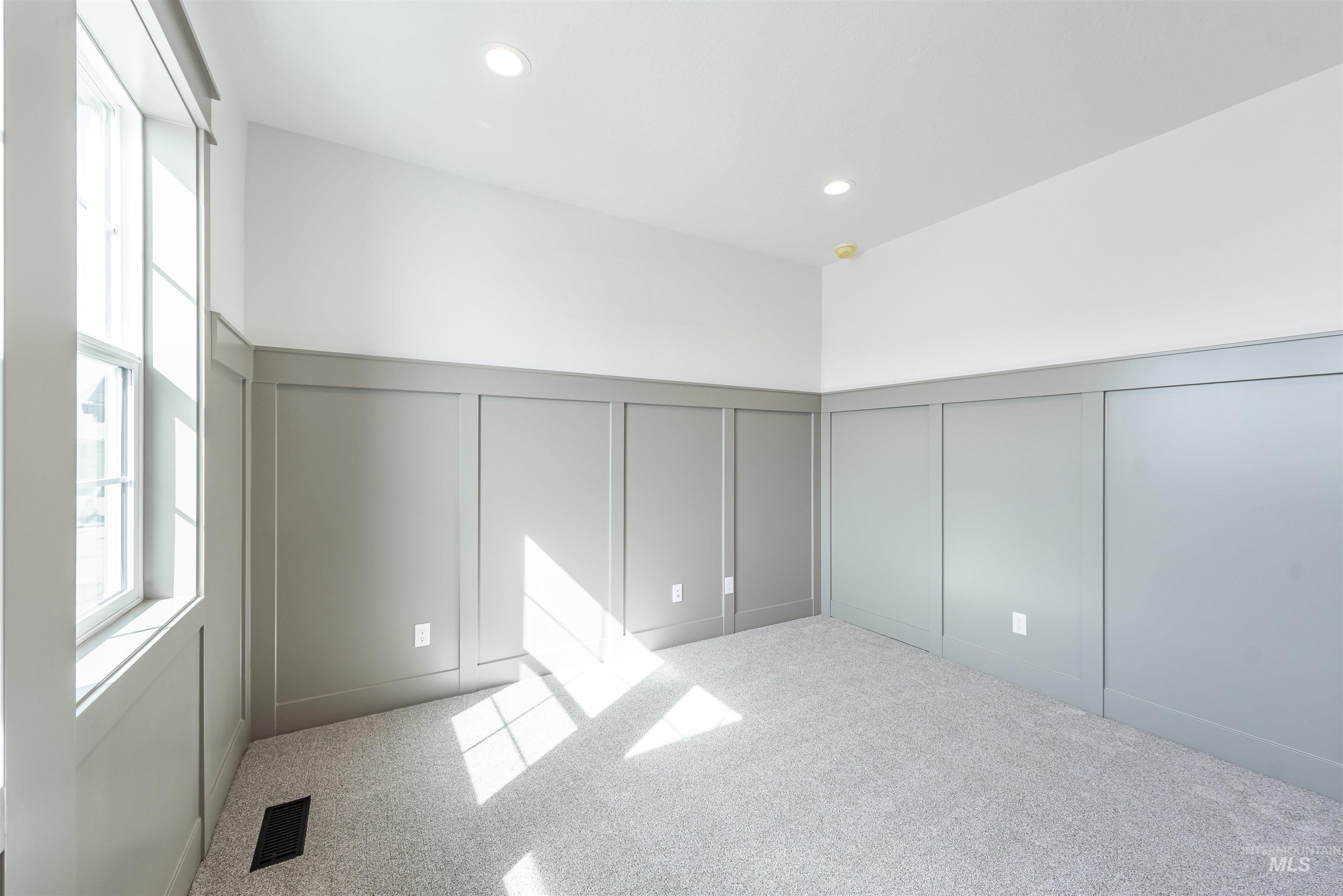 410 South Diesel Way Boise, ID 83716 - Photo 19 of 49 Unfurnished bedroom featuring a decorative wall, light carpet, a wainscoted wall, and recessed lighting