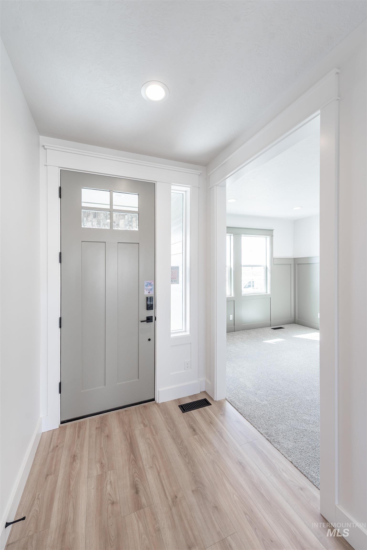 410 South Diesel Way Boise, ID 83716 - Photo 2 of 49 Foyer with light wood finished floors, healthy amount of natural light, and recessed lighting