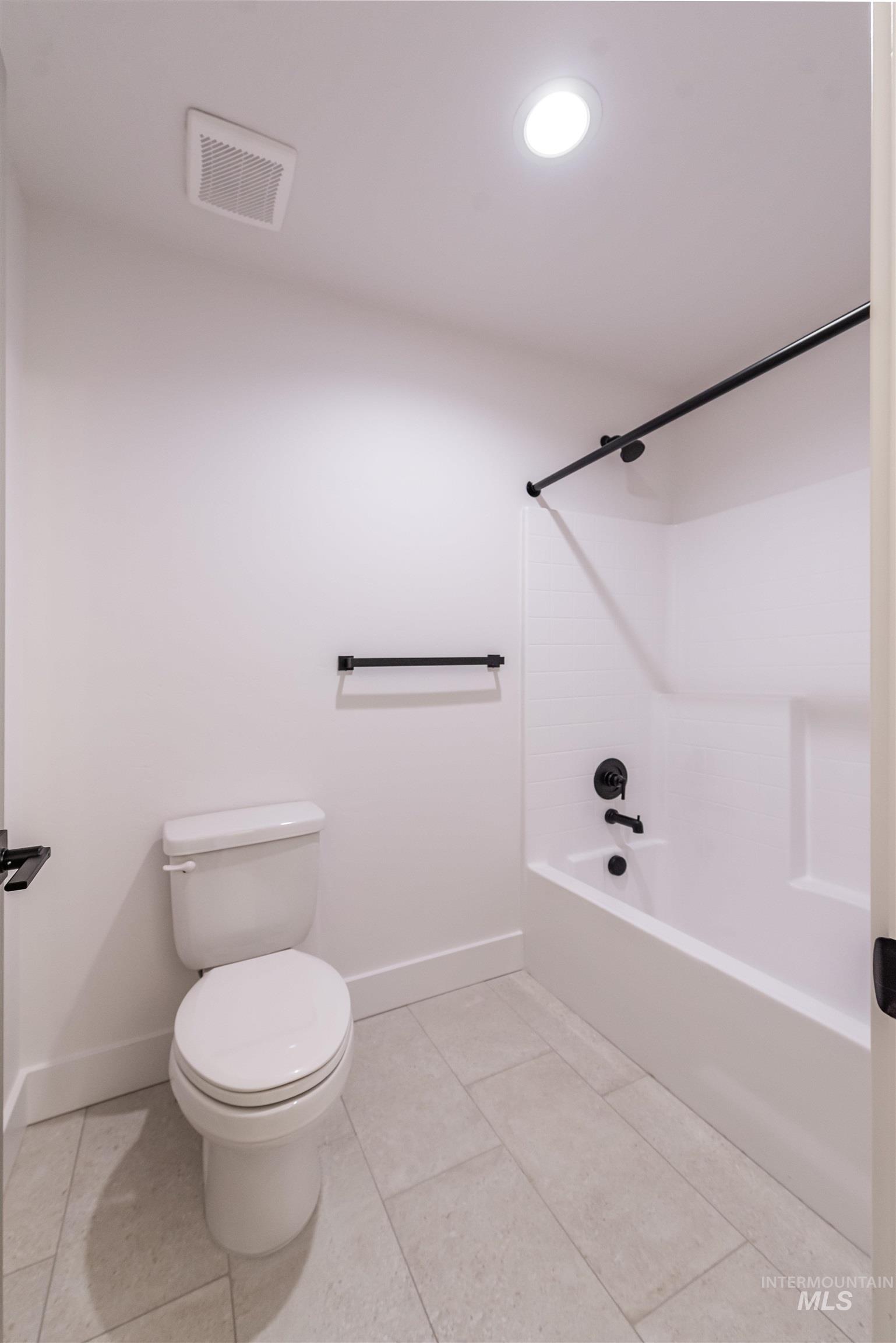 410 South Diesel Way Boise, ID 83716 - Photo 40 of 49 Bathroom featuring shower / bathtub combination, light tile patterned floors, and recessed lighting