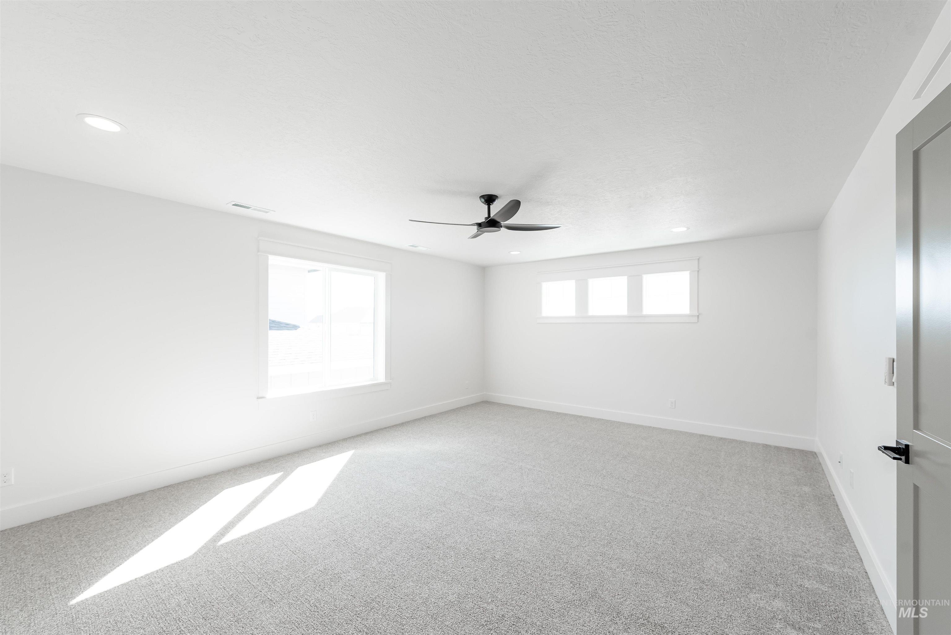 410 South Diesel Way Boise, ID 83716 - Photo 44 of 49 Spare room featuring light carpet, a ceiling fan, and recessed lighting