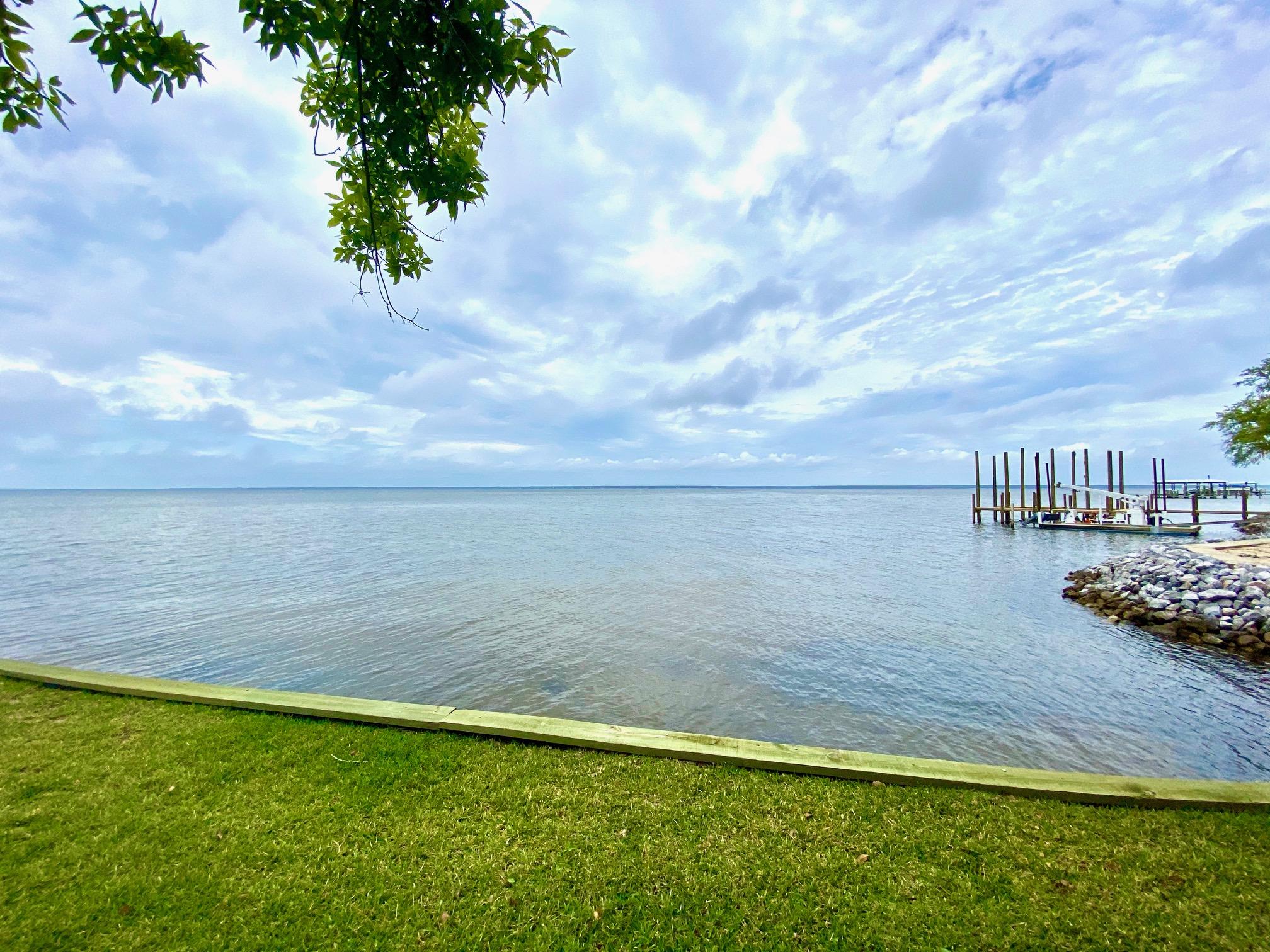 1.20-acres Driftwood Point Road Santa Rosa Beach, FL 32459 - Photo 1 of 9 a view of a lake with a big yard