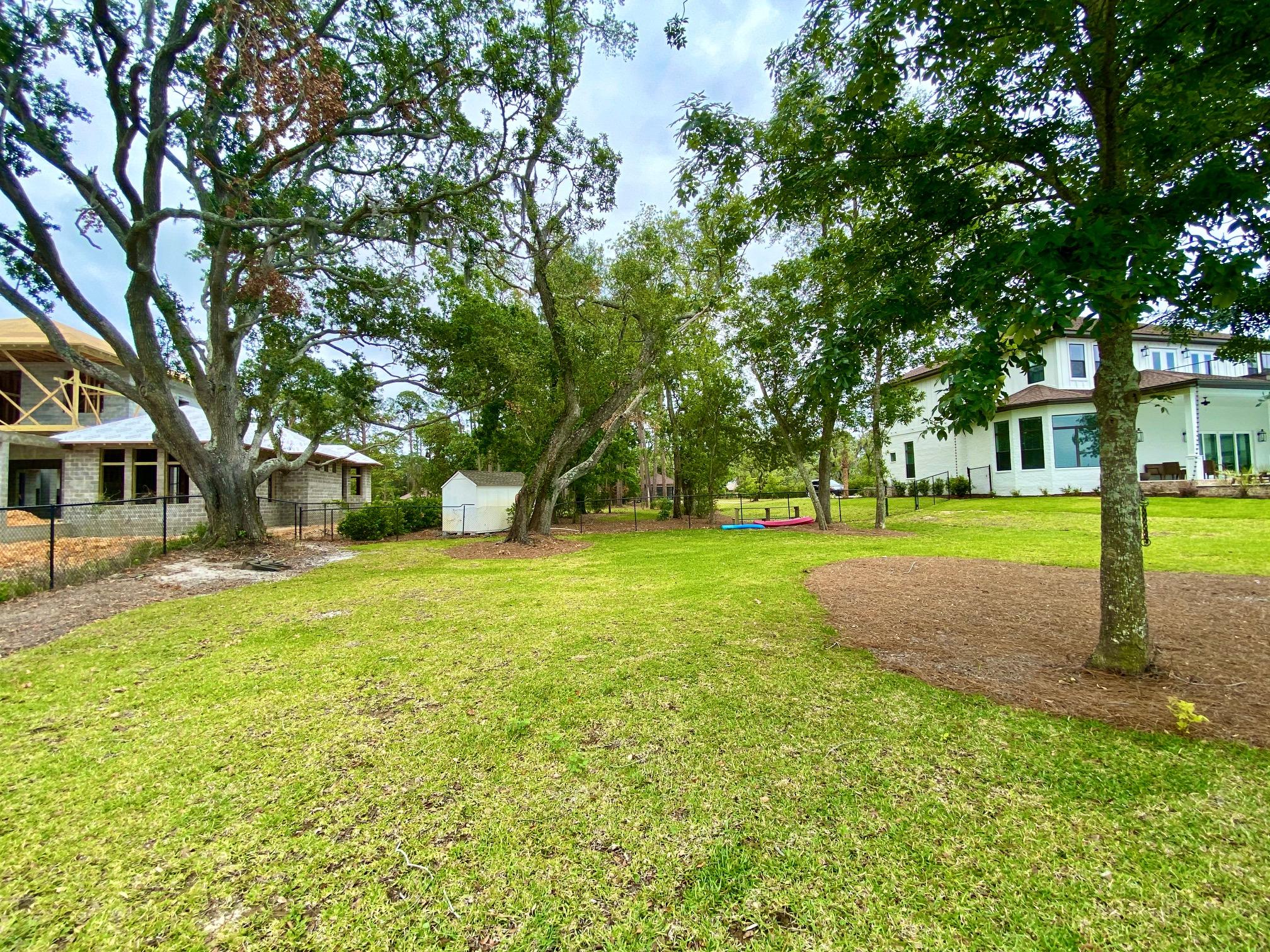1.20-acres Driftwood Point Road Santa Rosa Beach, FL 32459 - Photo 6 of 9 a view of a house with a big yard and large trees
