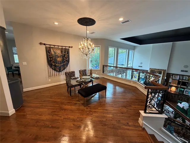 a dining room with furniture and window