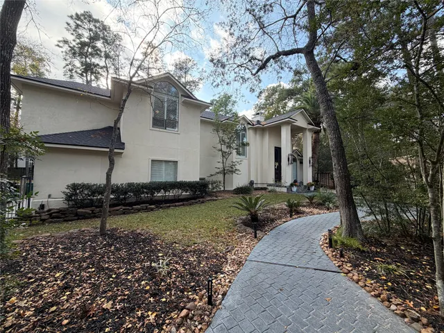 a living room with fireplace furniture and a fireplace