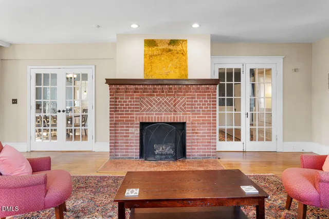 a living room with furniture windows and a fireplace